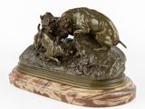 bronze sculpture of a dog and a cat on a marble base