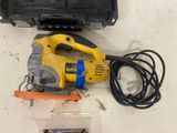 a yellow and black corded electric tool on a table