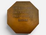 an image of a bronze plaque with a quote on it