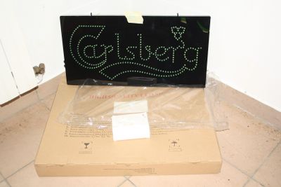 a box with a sign on it sitting on the floor