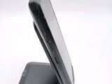 a close up of a cell phone on a stand