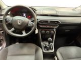 the interior of a car with a steering wheel and dashboard controls