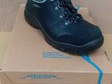 a box with a pair of black shoes on it