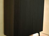 an image of a black cabinet in a living room