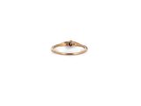 a gold ring with a single diamond on top of it