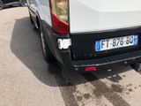 a white van that is parked in a parking lot