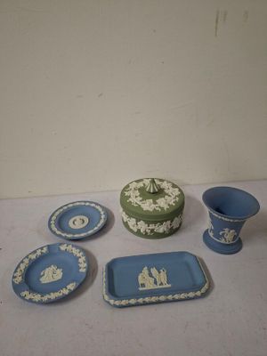 a lot of blue and white plates and bowls on the table