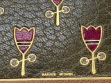 an old book with a bunch of flowers on it
