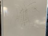 a white refrigerator that has a lot of scratches on it