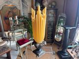 a large vase that is sitting on a glass table