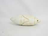 a small white object that is on a white surface