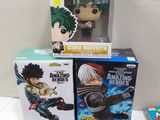 a lot of different anime action figures on the table