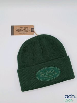 the hat is green and has a green patch on it