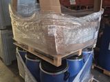 a pile of boxes on a pallet in a warehouse