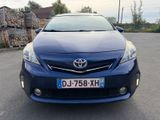 the front of a blue toyota prius parked in a parking lot