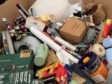 a cardboard box filled with assorted items in it