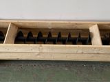 a wooden box with a bunch of knives inside of it