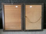 two wooden frames with rope hanging from them on a wall