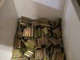 a box full of metal parts in the middle of a room