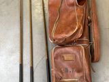 a bag of golf clubs and a bag of golf clubs on the floor