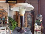 a lamp that is sitting on a table in a room