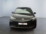 the front view of a black car parked in a white room