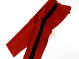 a close up of a pair of red pants on a white surface