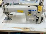 a sewing machine that is sitting on a table