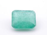 a green emerald stone on a white background