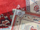 a close up of a rug with a tag on it