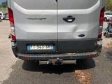 a silver van that is parked in a parking lot
