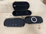 two mp3 players sitting next to each other on a table
