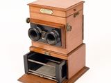 a small wooden box with two bins on top of it