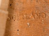 an old book with writing on it sitting on a table