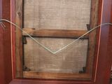 an old picture frame with a picture of a cat in it