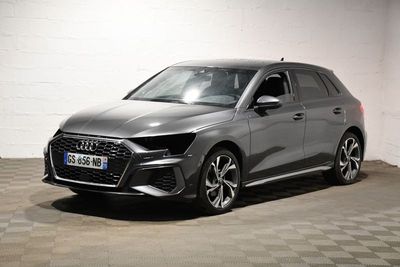 the audi e - trc is parked in a garage with a checkered floor