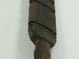 a wooden object hanging on the wall in the room