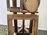 a wooden chair that has a mirror on top of it