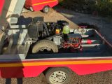 a truck with a small engine in the back of it