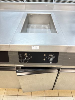 a stainless steel counter top with a sink and a dishwasher