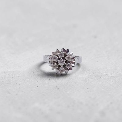 an image of a diamond ring on a white surface