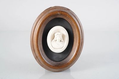 a picture of a statue of a woman in a wooden frame
