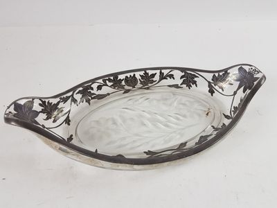 a glass bowl with a black and white design on it
