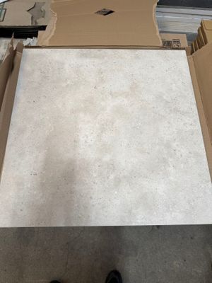 a person standing in front of a box with a piece of paper
