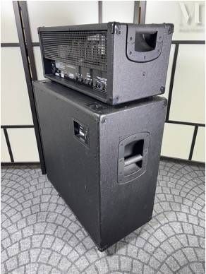 two amps stacked on top of each other on the floor