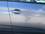 a close up of a car ' s door handle and door handle
