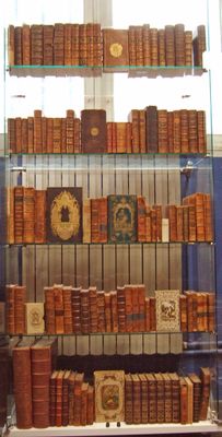 many books on display in a glass case