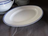 many plates and bowls sitting on a table