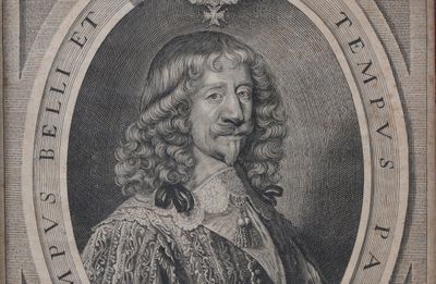 portrait of a man with curly hair and a moustache in an oval frame