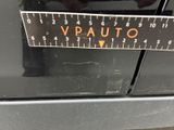 a close up of a sticker on a car ' s bumper